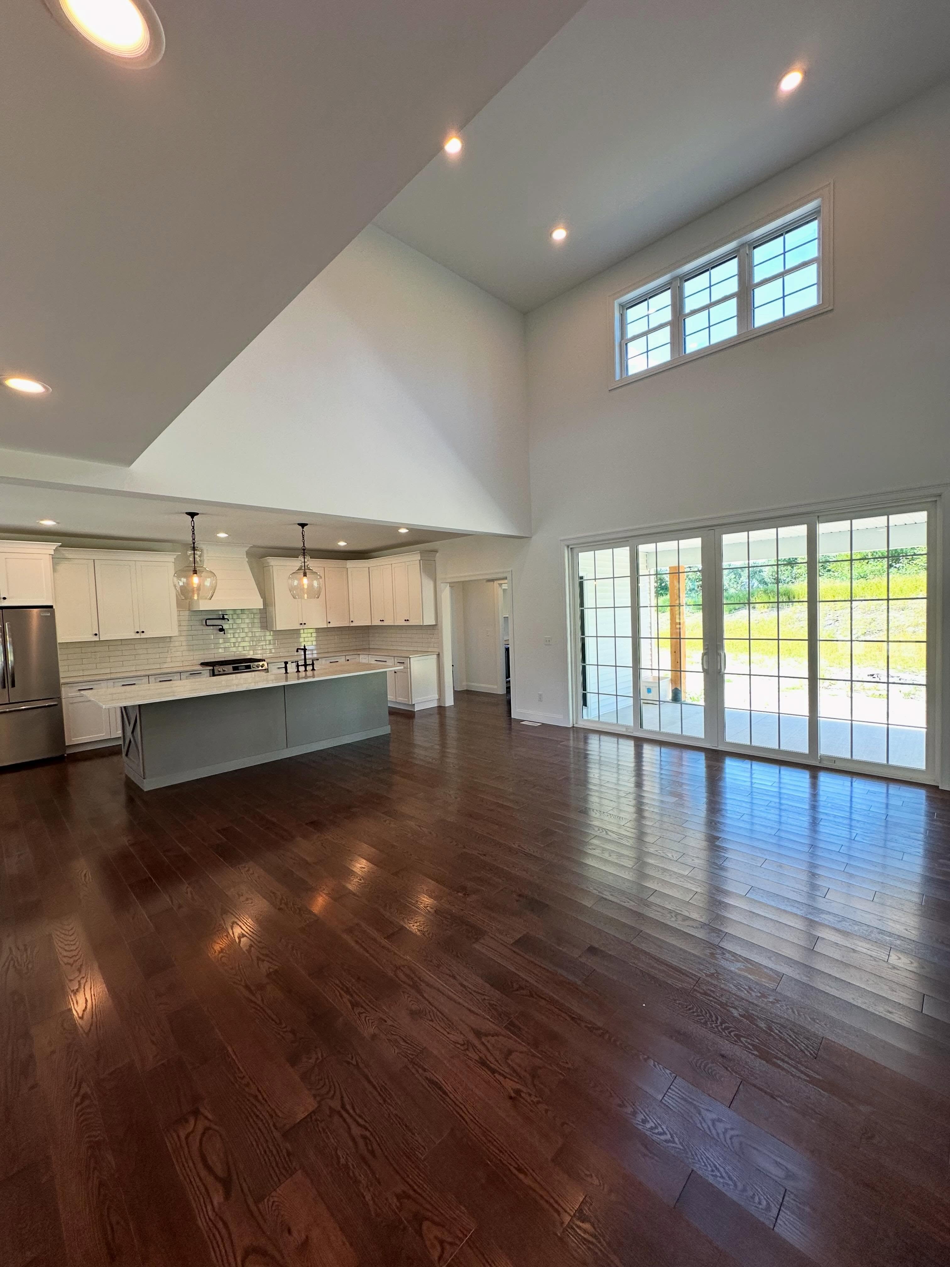 Two-story vaulted great room with kitchen island